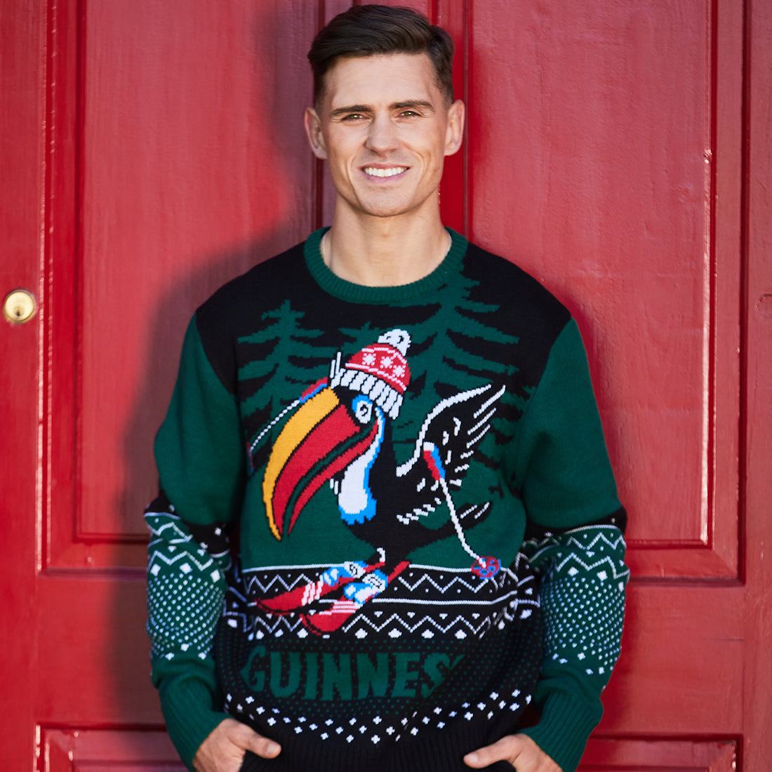 Man wearing Guinness Toucan Christmas jumper