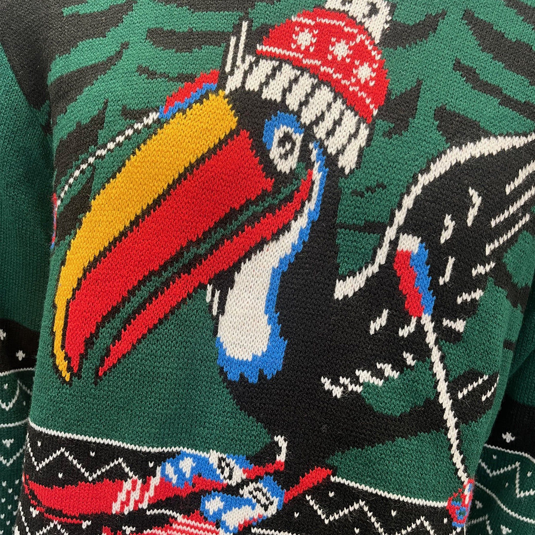 Close-up of Guinness Toucan Christmas jumper knitted design