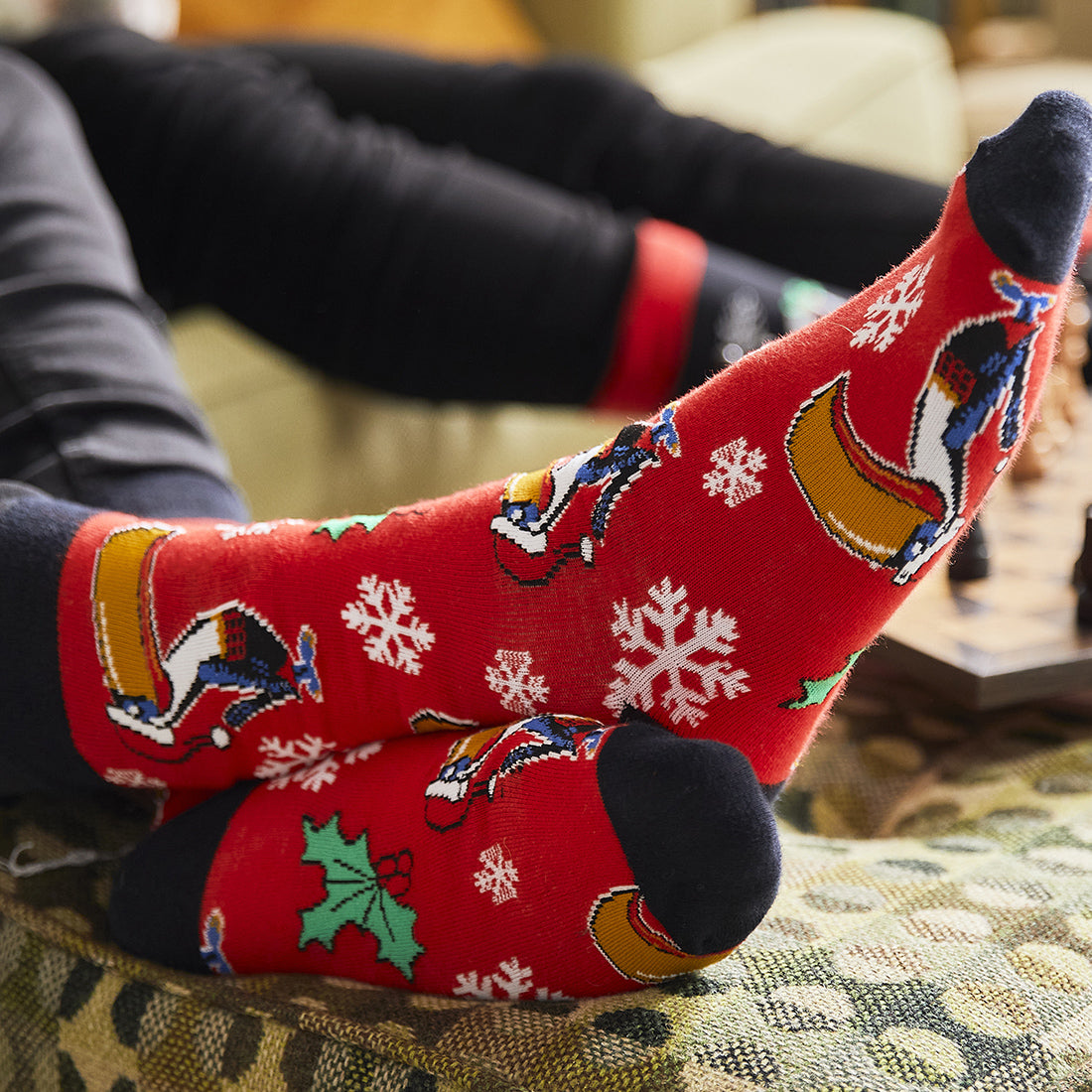 Guinness Toucan Christmas socks in red being worn